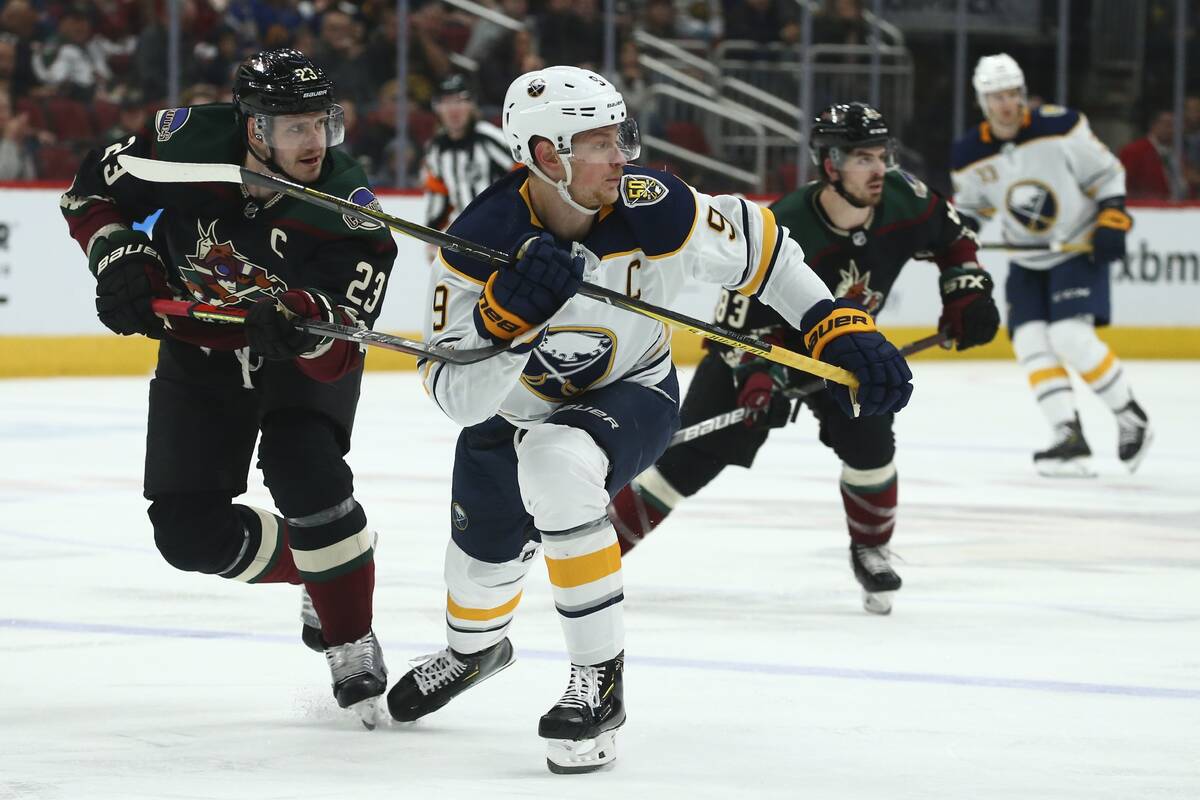 Buffalo Sabres center Jack Eichel (9) and Arizona Coyotes defenseman Oliver Ekman-Larsson (23) ...