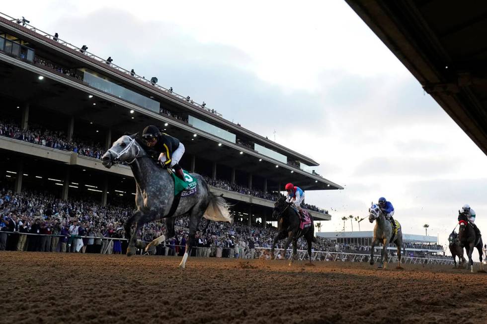 Joel Rosario rides Knicks Go, left, to victory during the Breeders' Cup Classic race at the Del ...