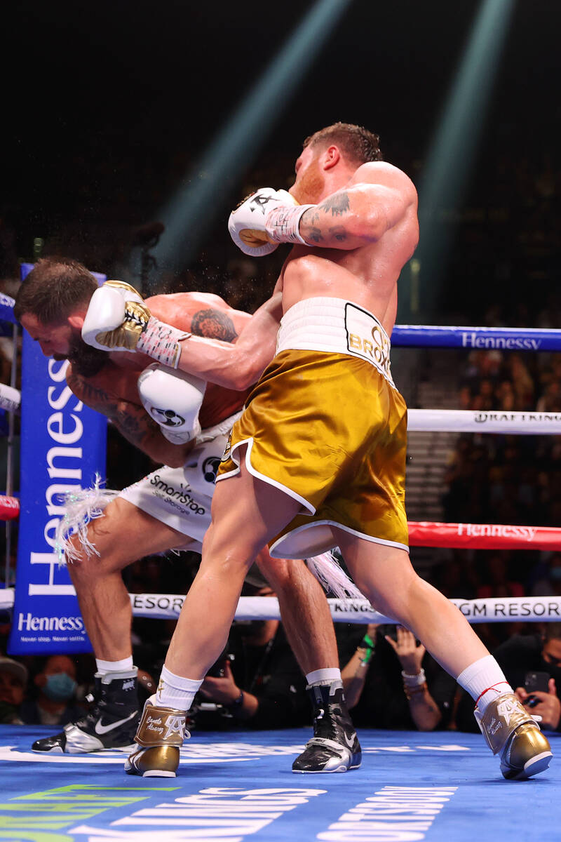 Saul “Canelo” Alvarez connects a punch against Caleb Plant in the 11th round of a ...