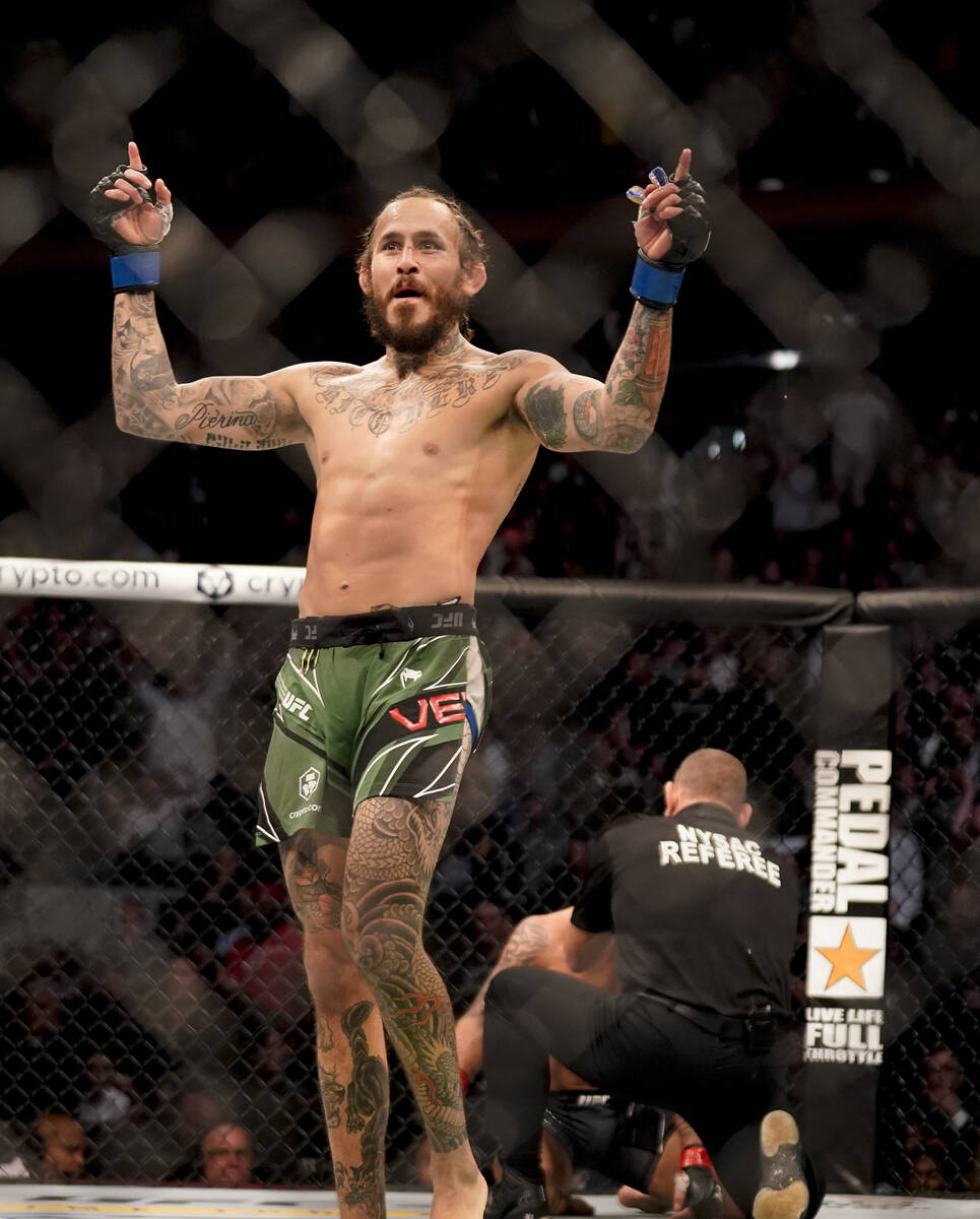 Marlon Vera reacts after knocking out Frankie Edgar during a bantamweight mixed martial arts bo ...