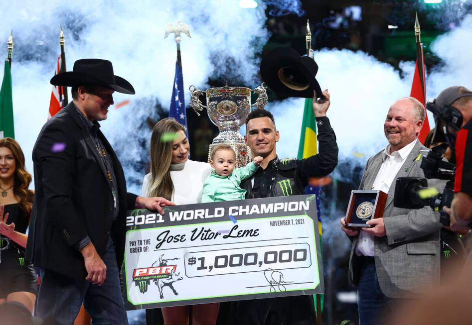 Jose Vitor Leme celebrates with his wife Amanda, and son, Theodoro, after becoming the back-to- ...