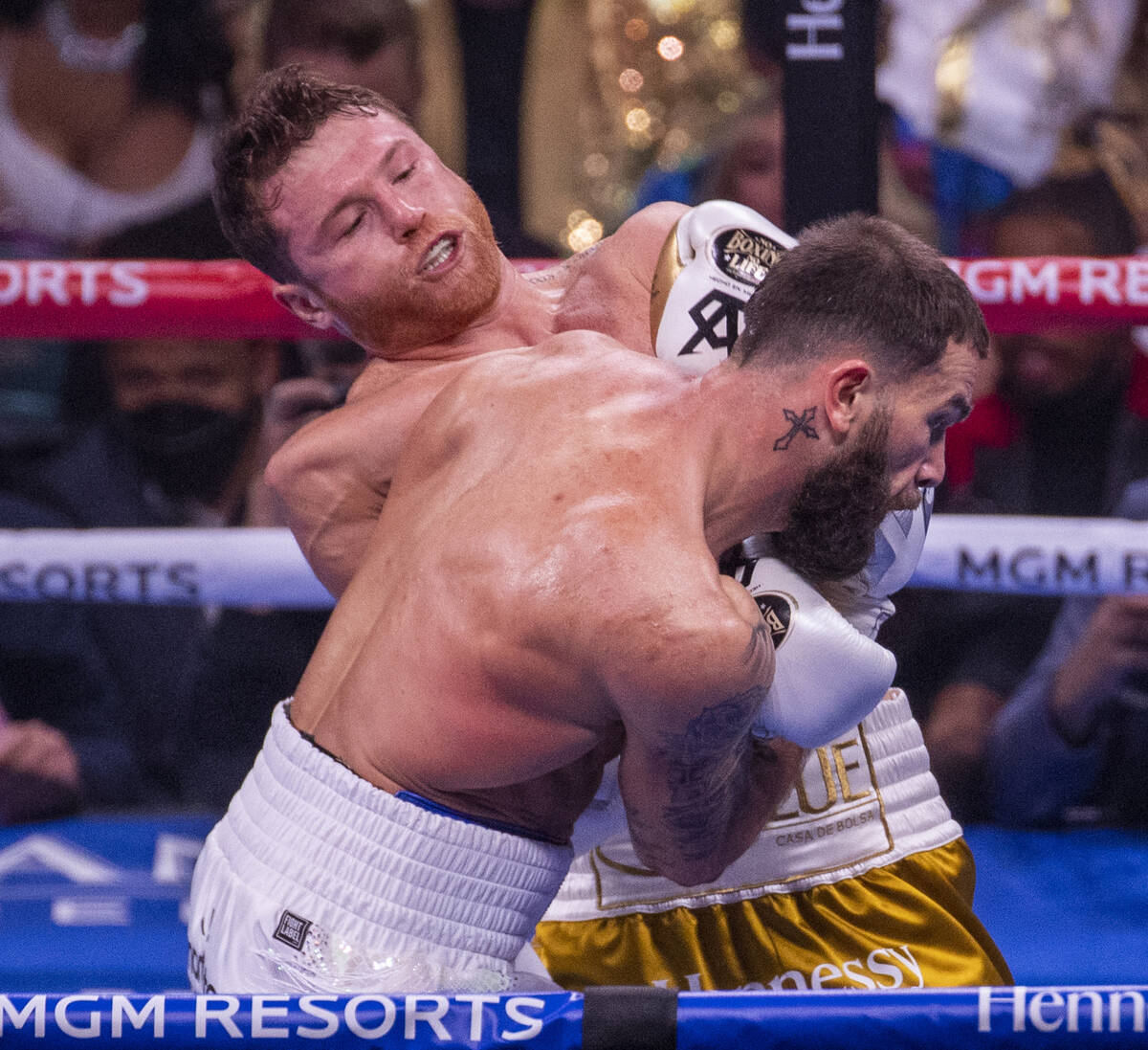 Saul "Canelo" Alvarez connects with the chin of Caleb Plant in the 1st round during t ...