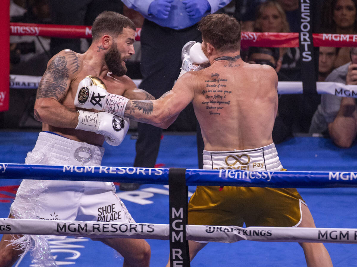 Caleb Plant connects with the chin of Saul "Canelo" Alvarez in the 1st round during t ...