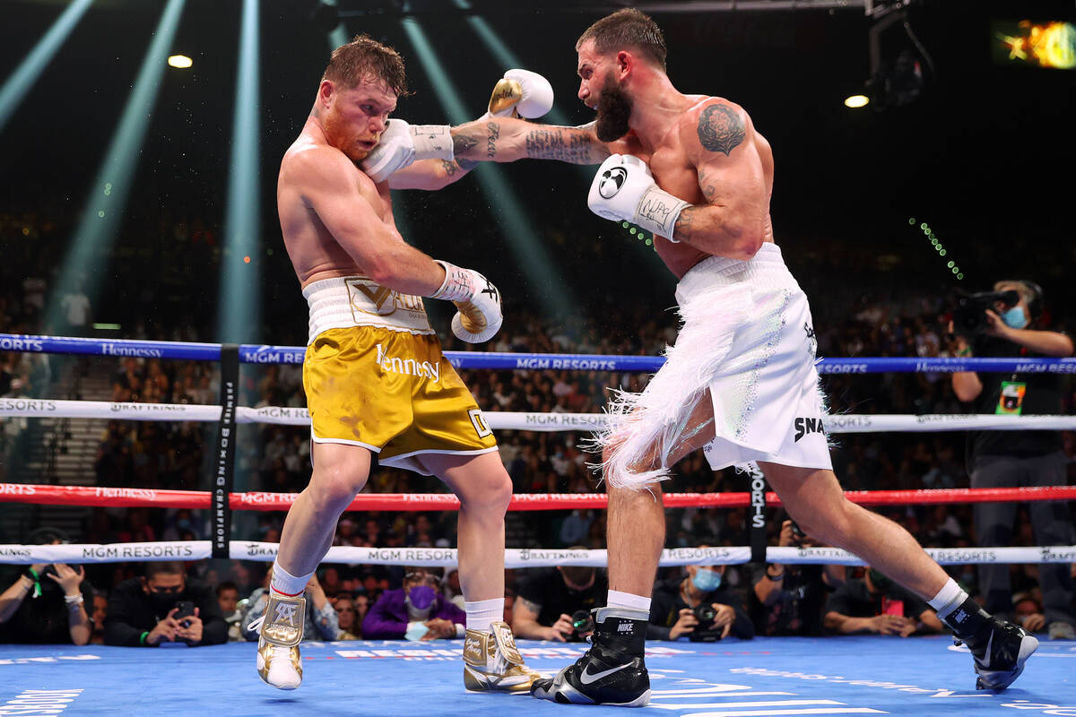 Caleb Plant, right, connects a punch against Saul “Canelo” Alvarez in the ninth r ...