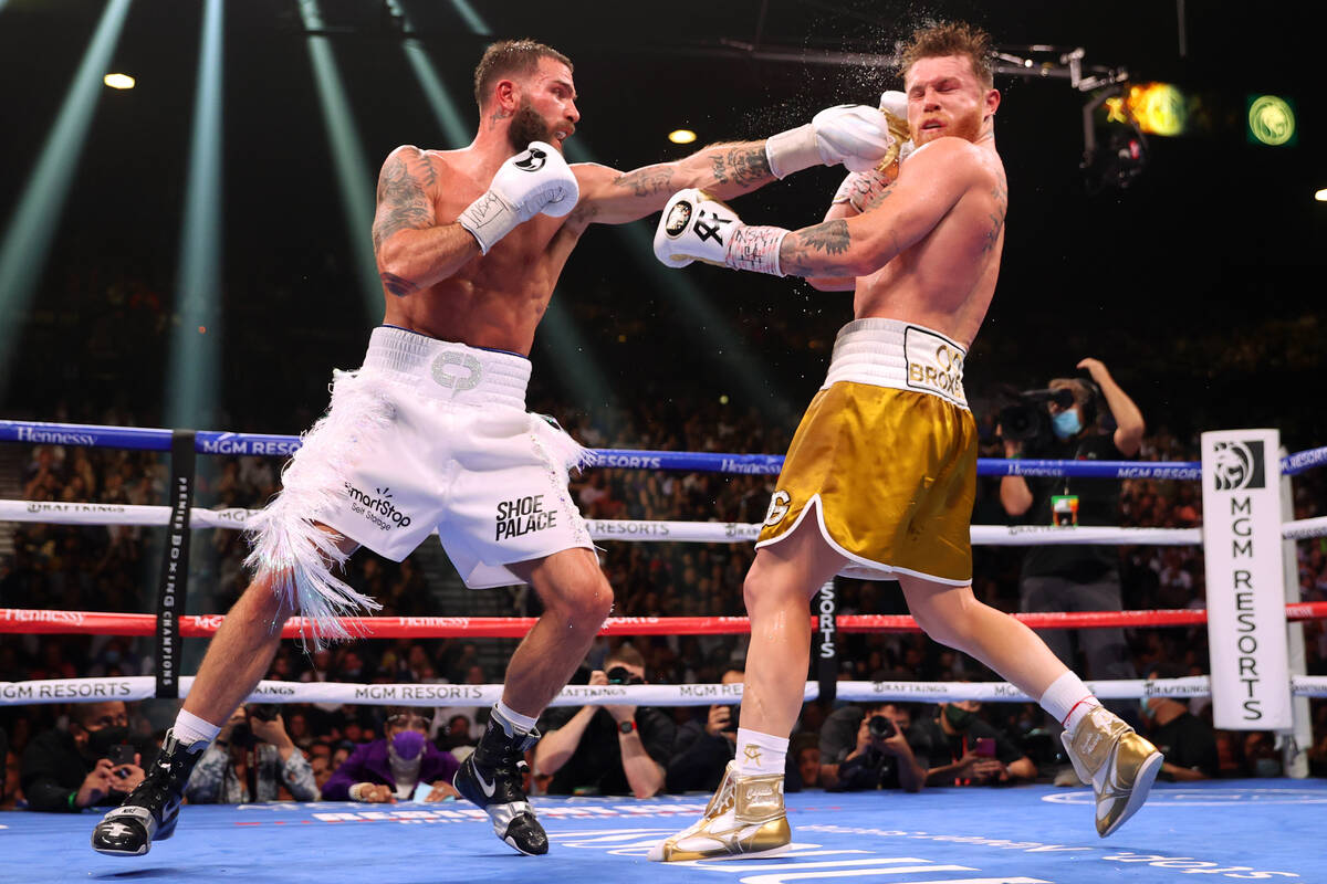 Caleb Plant, left, connects a punch against Saul “Canelo” Alvarez in the 10th rou ...
