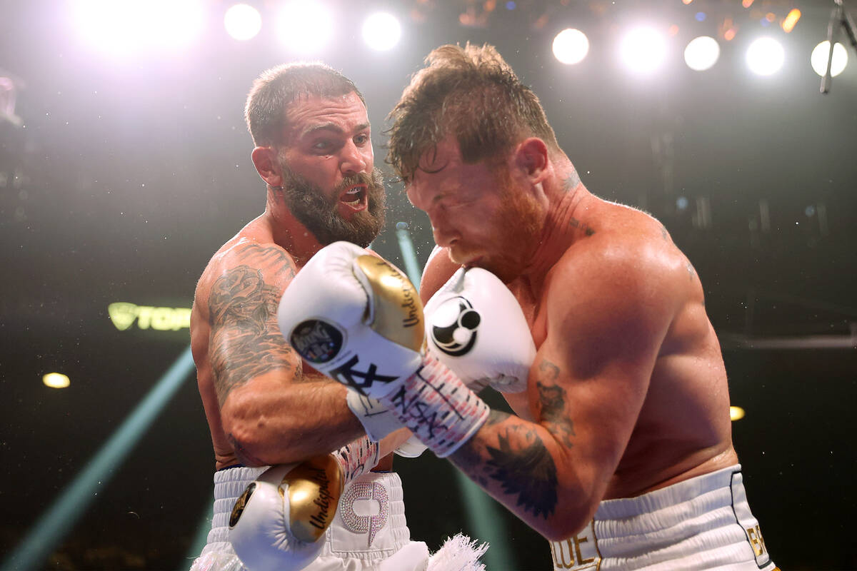 Caleb Plant, left, connects a punch against Saul “Canelo” Alvarez in the fifth ro ...