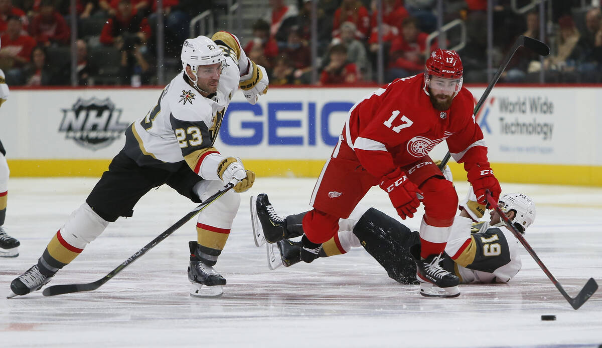 Vegas Golden Knights defenseman Alec Martinez (23) pursues Detroit Red Wings defenseman Filip H ...