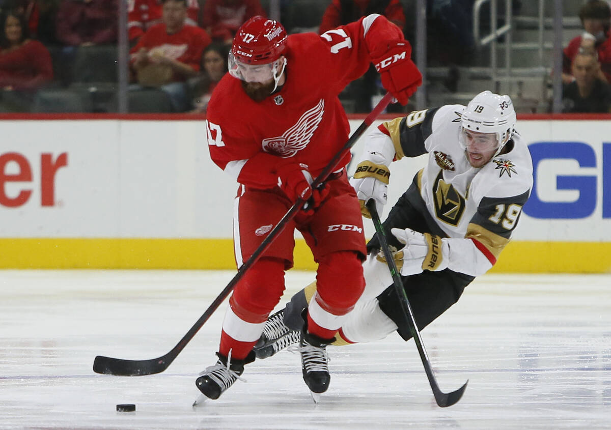 Detroit Red Wings defenseman Filip Hronek (17) is pursued downice by Vegas Golden Knights right ...