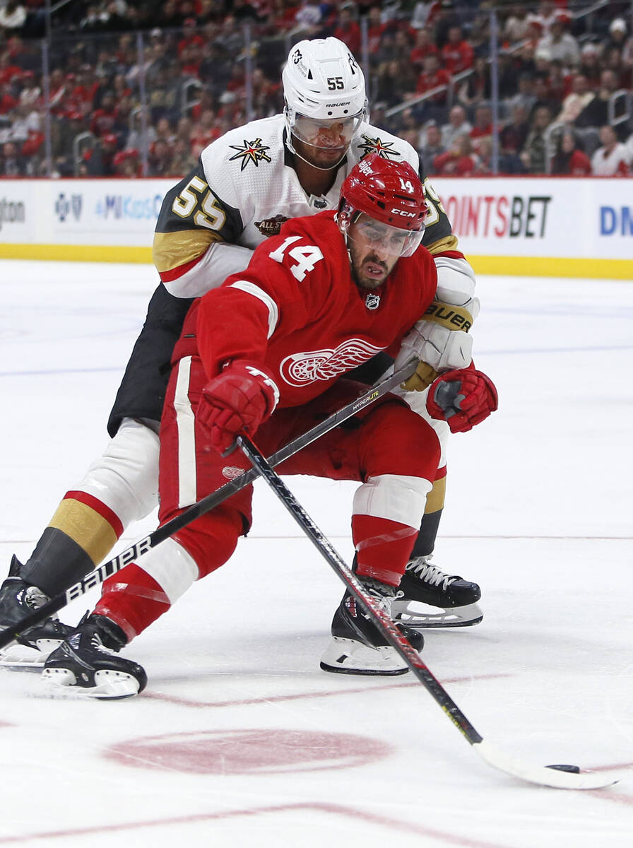 Vegas Golden Knights right wing Keegan Kolesar (55) tries to tie up Detroit Red Wings center Ro ...