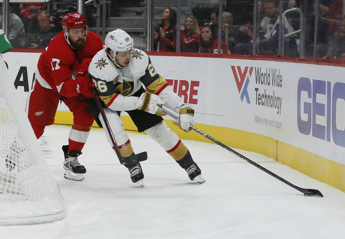 Detroit Red Wings defenseman Filip Hronek (17) pursues Vegas Golden Knights center Mattias Janm ...