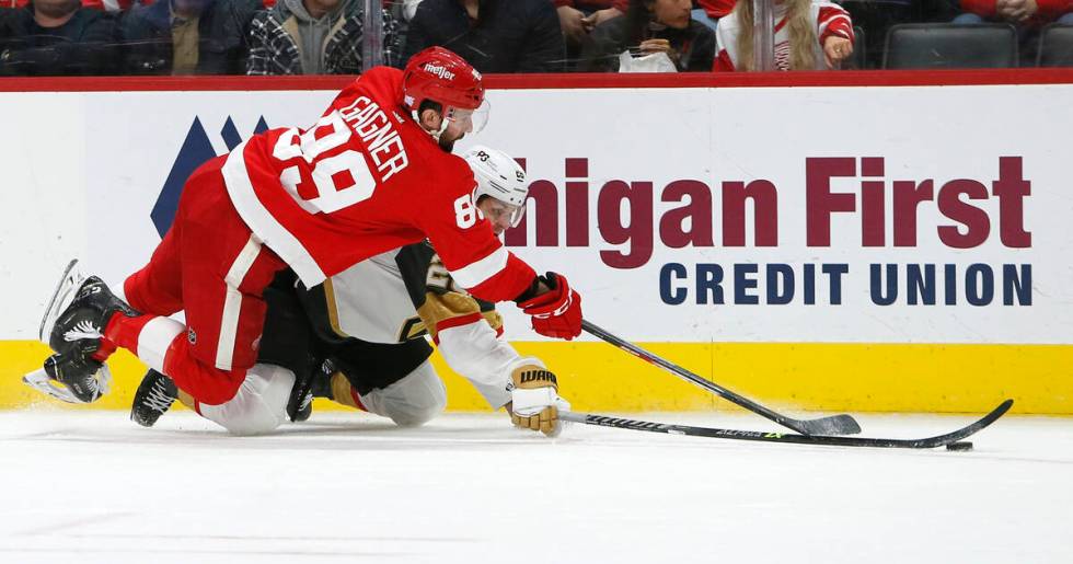 Detroit Red Wings center Sam Gagner (89) lands on Vegas Golden Knights center Mattias Janmark ( ...