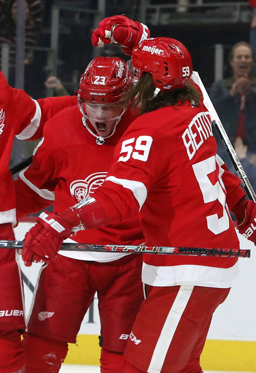 Detroit Red Wings left wing Lucas Raymond (23) celebrates with left wing Tyler Bertuzzi (59) af ...