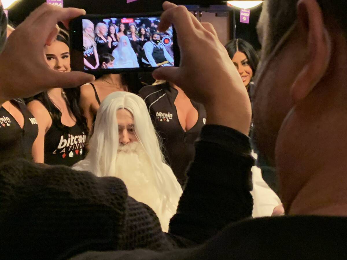 Media and fans swarm Phil Hellmuth as he arrives dressed as Gandalf the White from "The Lord of ...