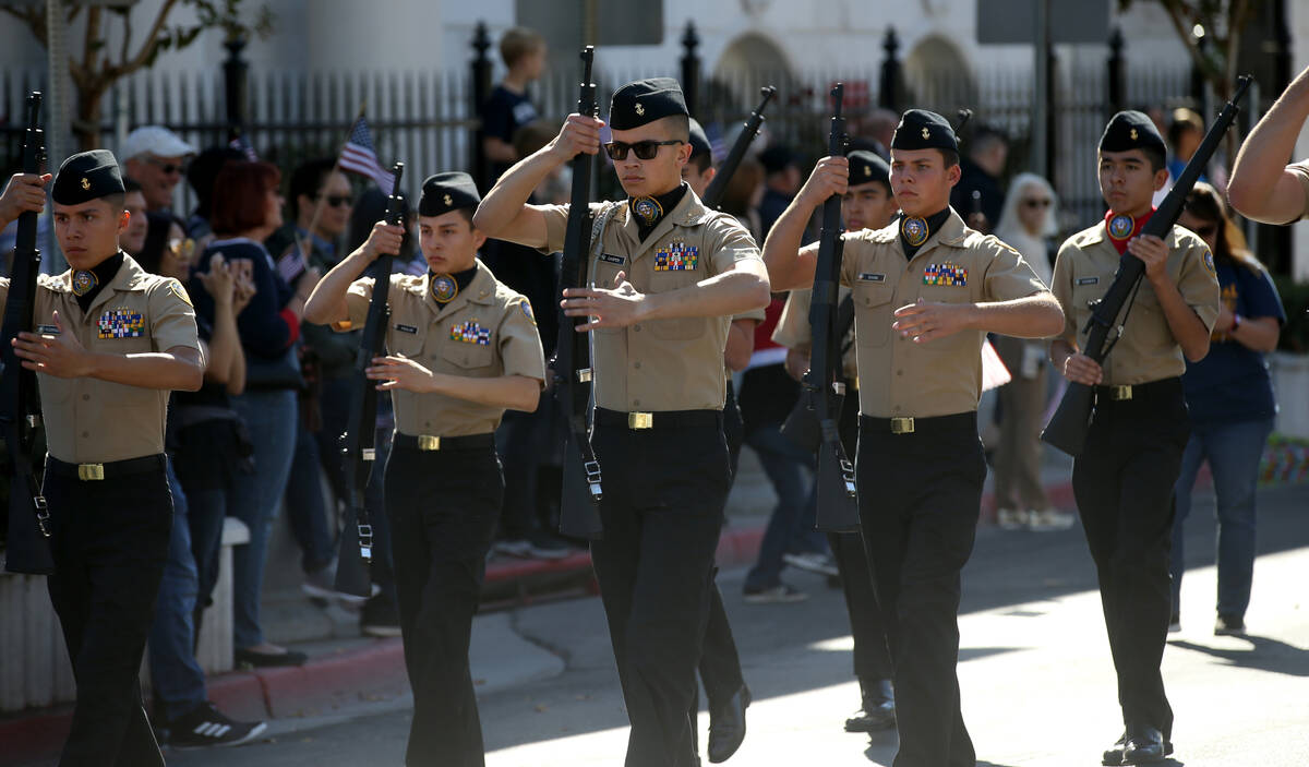 Centennial High School Navy Junior ROTC marches in the Veterans Day Parade in downtown Las Vega ...