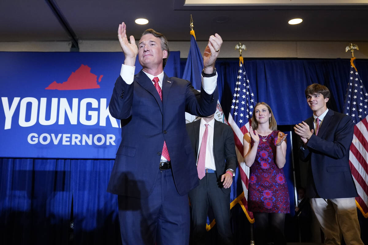 Virginia Gov.-elect Glenn Youngkin arrives to speak at an election night party in Chantilly, Va ...
