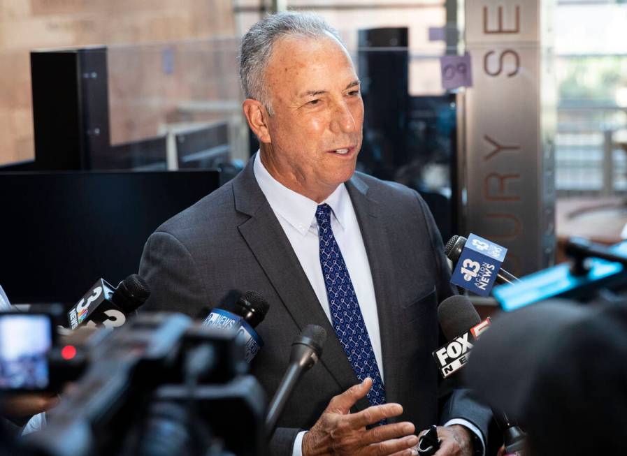 Clark County District Attorney Steve Wolfson addresses the news media after a status hearing in ...