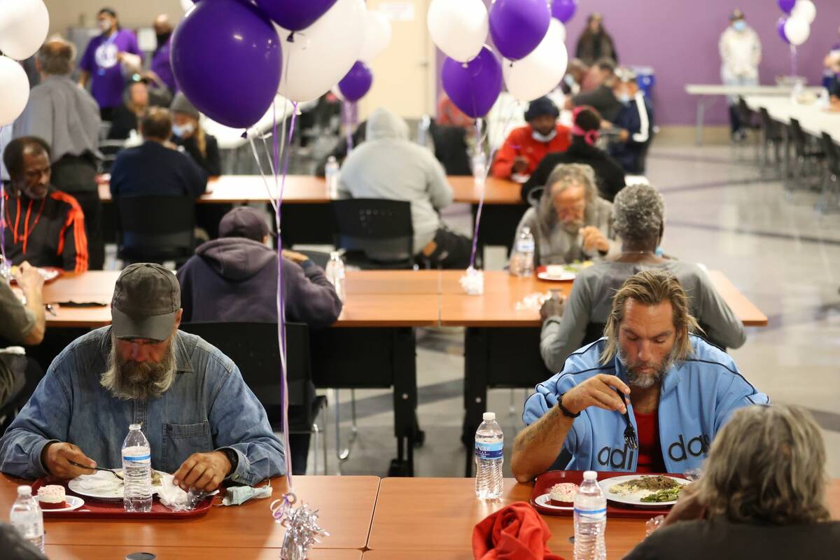 People dine during the reopening event of the St. Vincent Lied Dining Facility at the Catholic ...