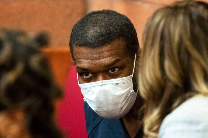 Willis Davis listens to his attorney, Betsy Allen, at North Las Vegas Justice Court on Thursday ...