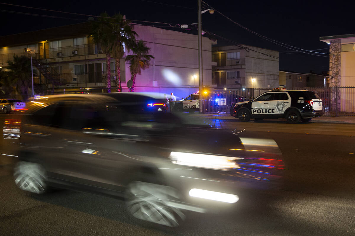 Traffic moves along Twain Avenue as Metropolitan police investigate a homicide near the 3700 bl ...