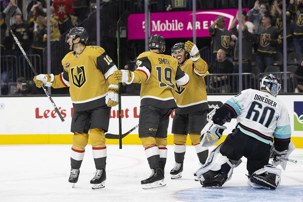 Vegas Golden Knights right wing Reilly Smith (19) celebrates with teammates Jonathan Marchessau ...