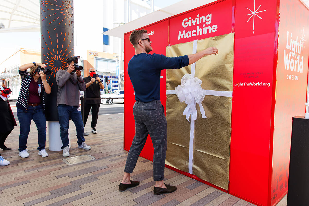 Singer Dan Reynolds of Imagine Dragons makes the first donation at the "Giving Machine&quo ...