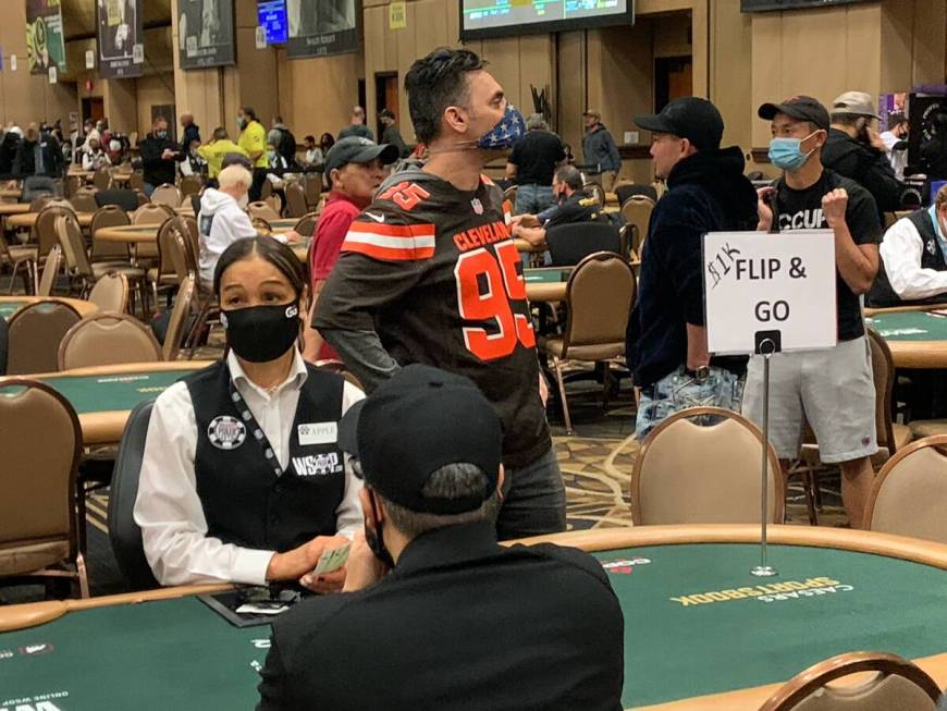 Players wait to start a last-minute satellite to get into the World Series of Poker Main Event ...