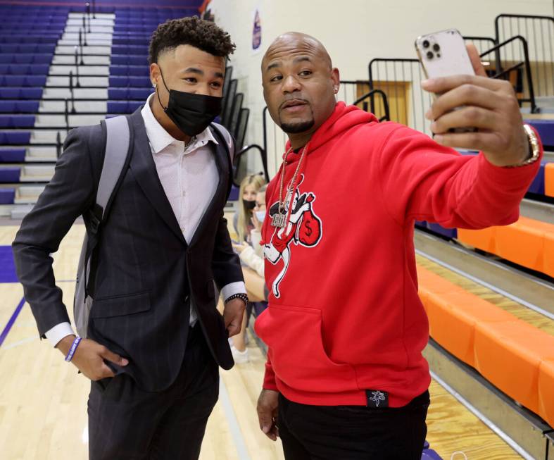 Justin Crawford poses with his father, former Major League Baseball player Carl Crawford, befor ...