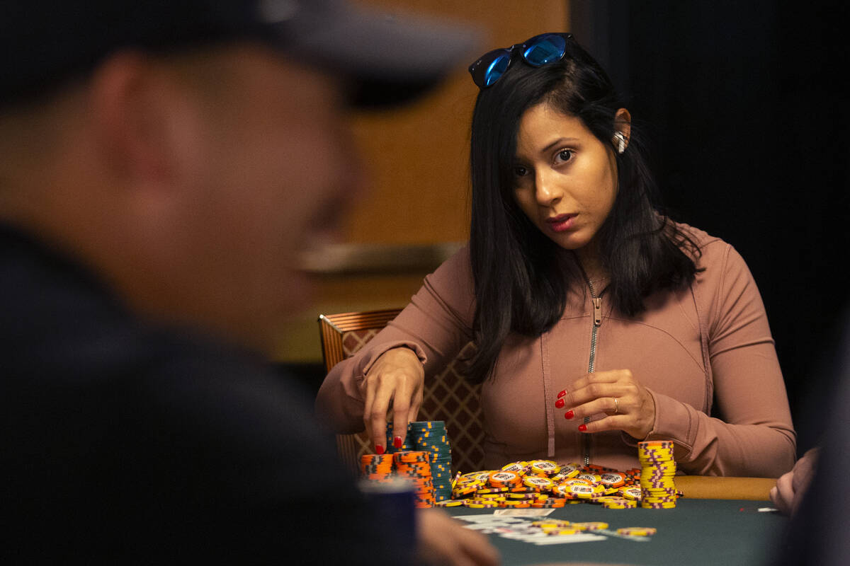 Chip leader Jessica Cai eyes her opponent during the World Series of Poker Main Event at the Ri ...