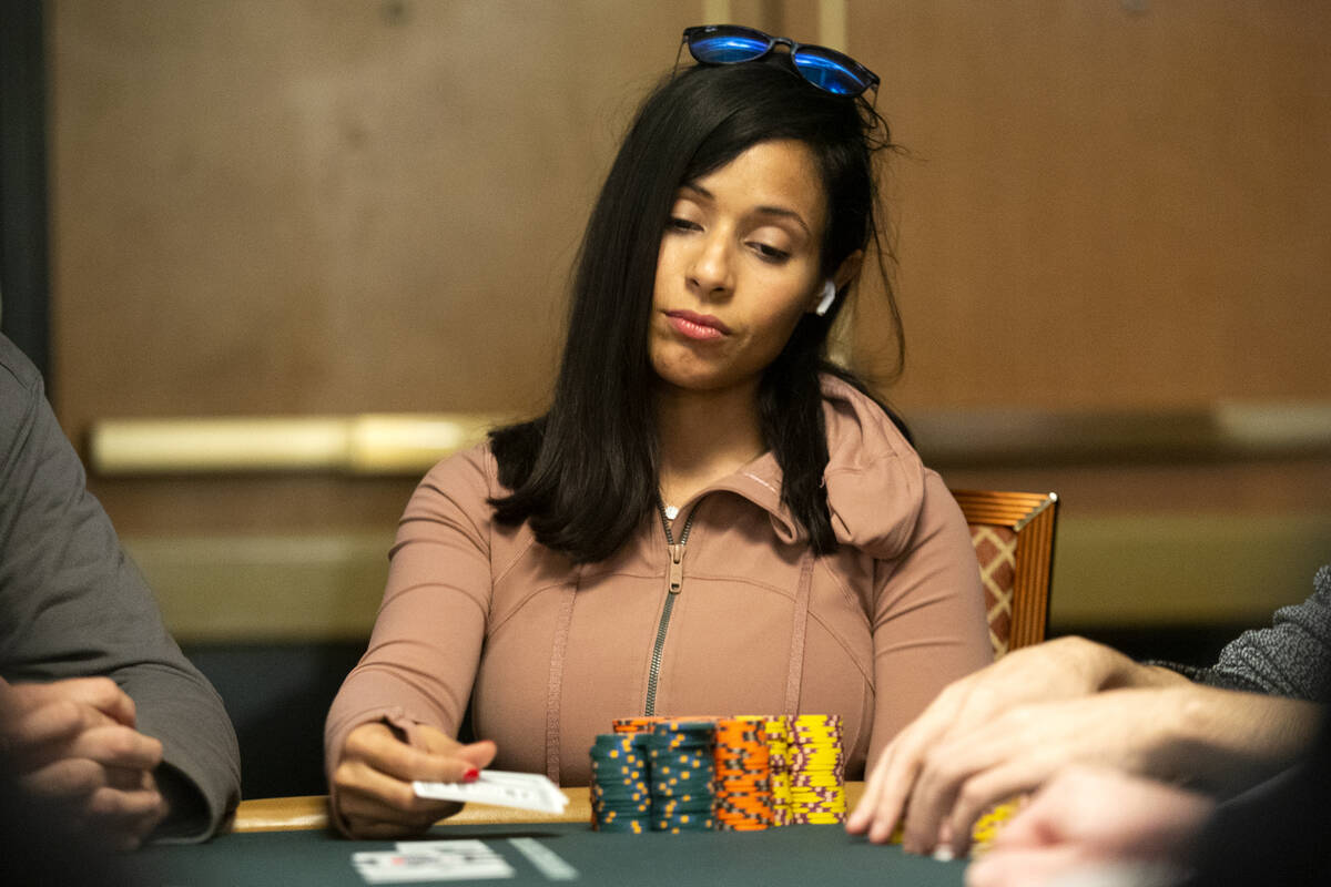 Chip leader Jessica Cai reacts to her hand during the World Series of Poker Main Event at the R ...