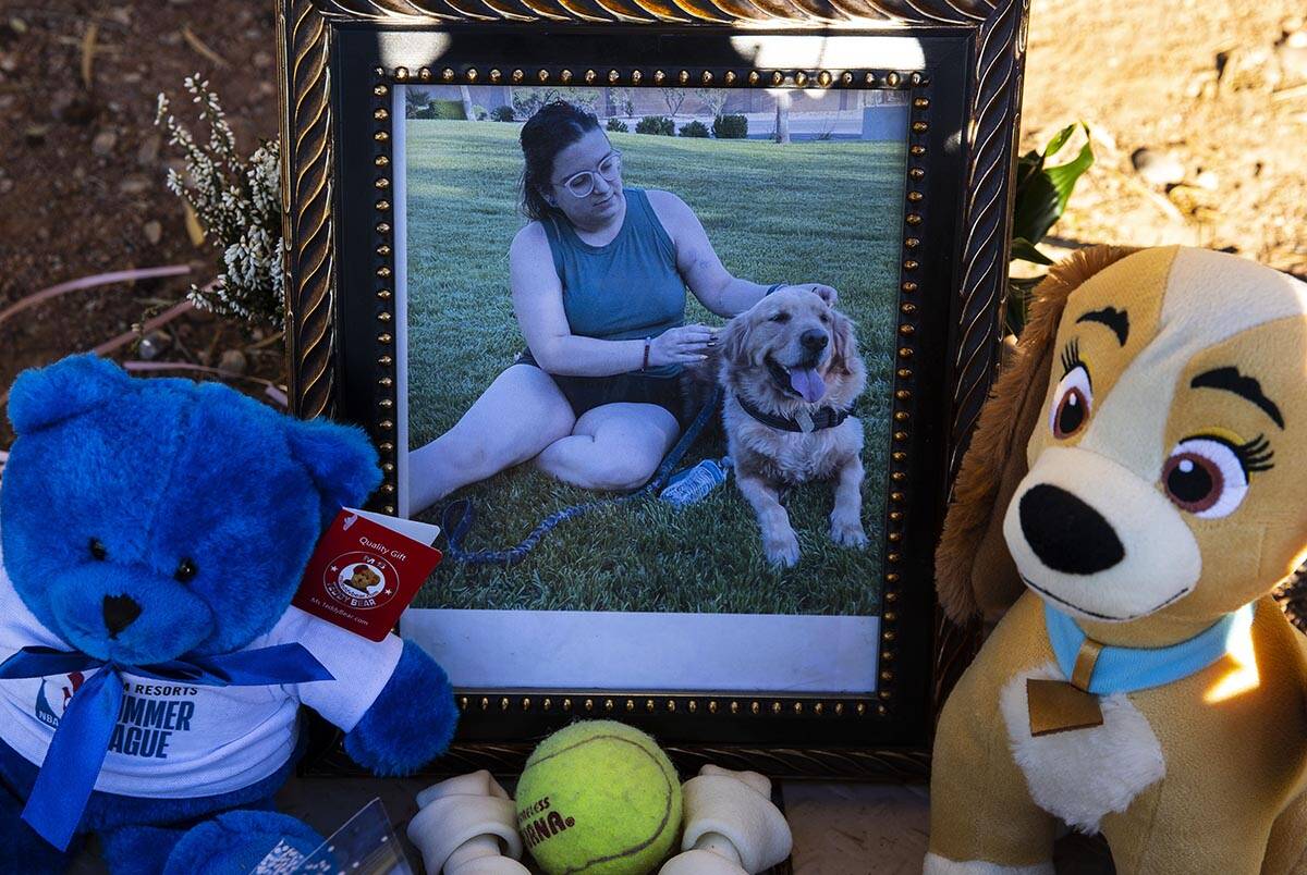 A photograph of Tina Tintor, 23, and her dog, Max, at a makeshift memorial site to honor them a ...