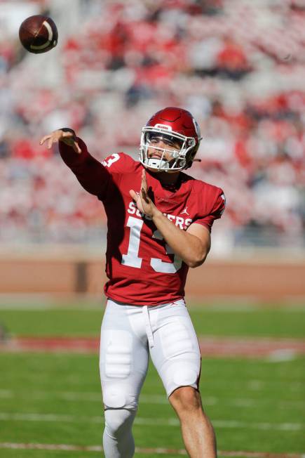 Oklahoma quarterback Caleb Williams (13) warms up before an NCAA college football game against ...