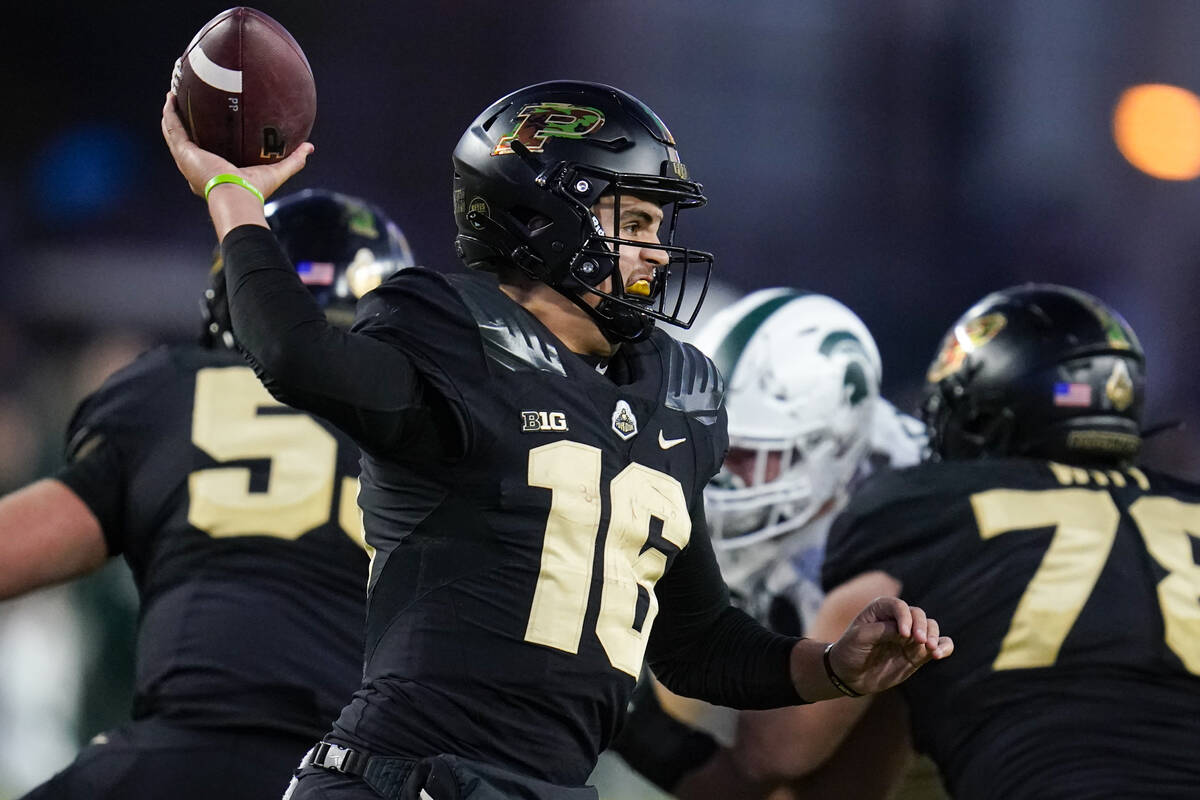 Purdue quarterback Aidan O'Connell (16) throws against Michigan State during the second half of ...
