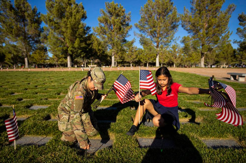 Nevada Army National Guard SSgt. Yvette Hernandez, left, and her daughter, Jasmine Flores, 10, ...