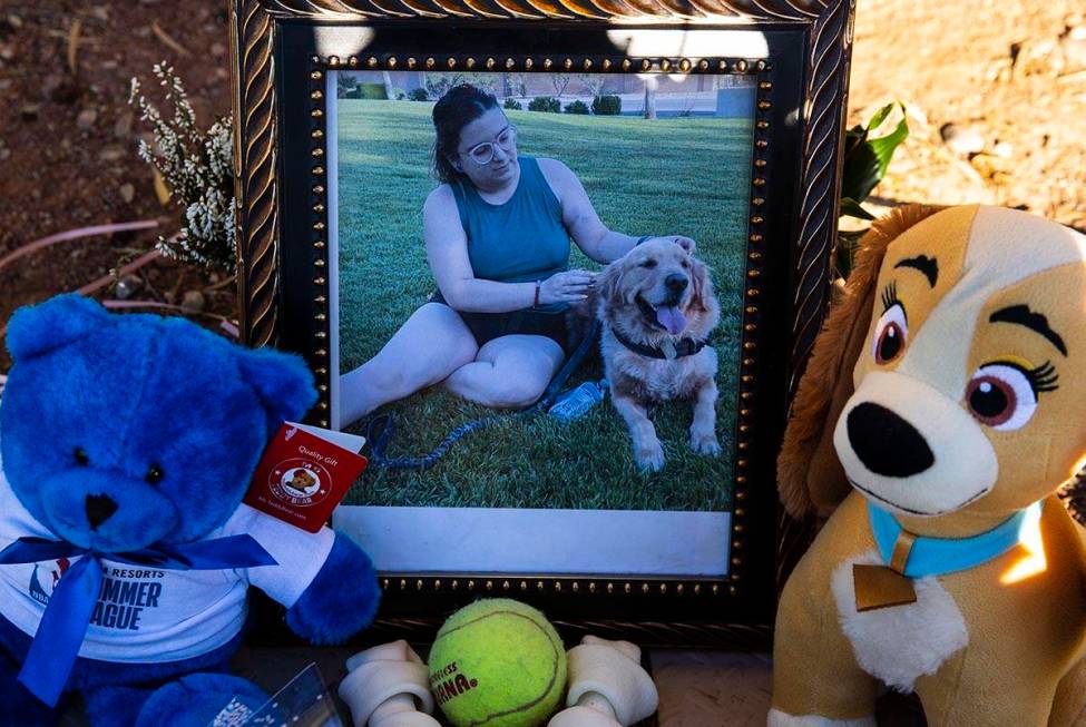 A photograph of Tina Tintor, 23, and her dog is placed at a makeshift memorial site to honor th ...