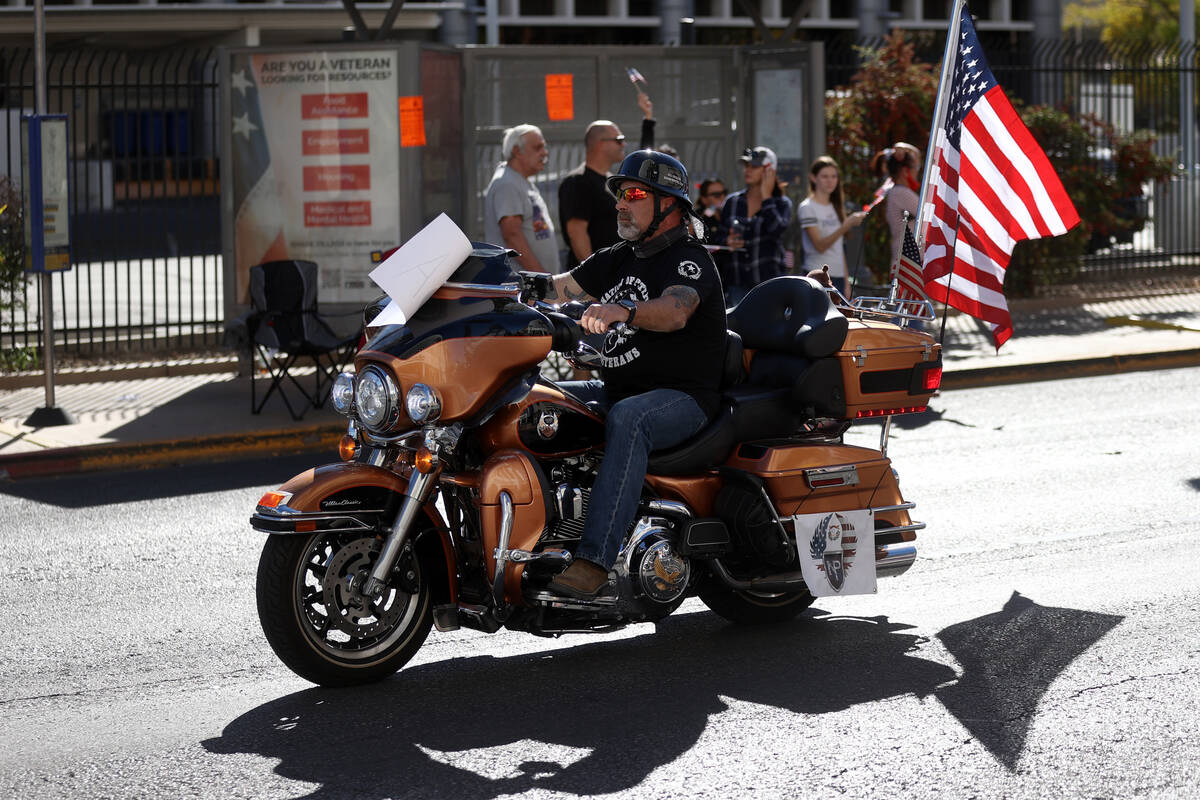 A motorcyclist participates during the Veterans Day parade on 4th Street in downtown Las Vegas, ...