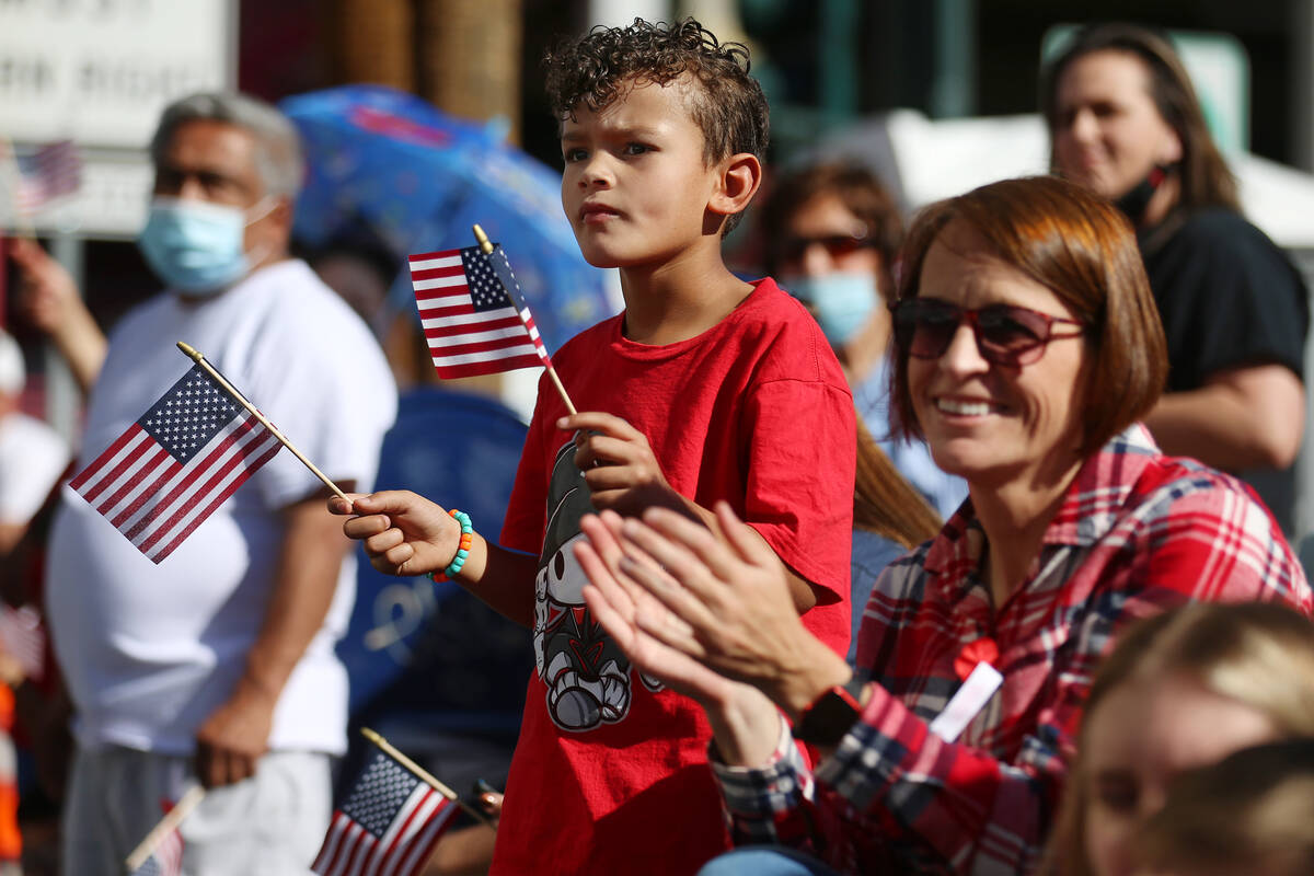 Melissa Pippin with her grandson Uriah Henson, 6, of Las Vegas, watch the Veterans Day parade o ...