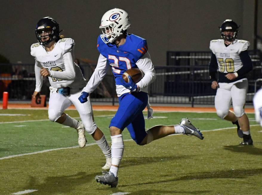 Bishop Gorman linebacker Garrett Pomerantz runs back an interception return during a 5A region ...