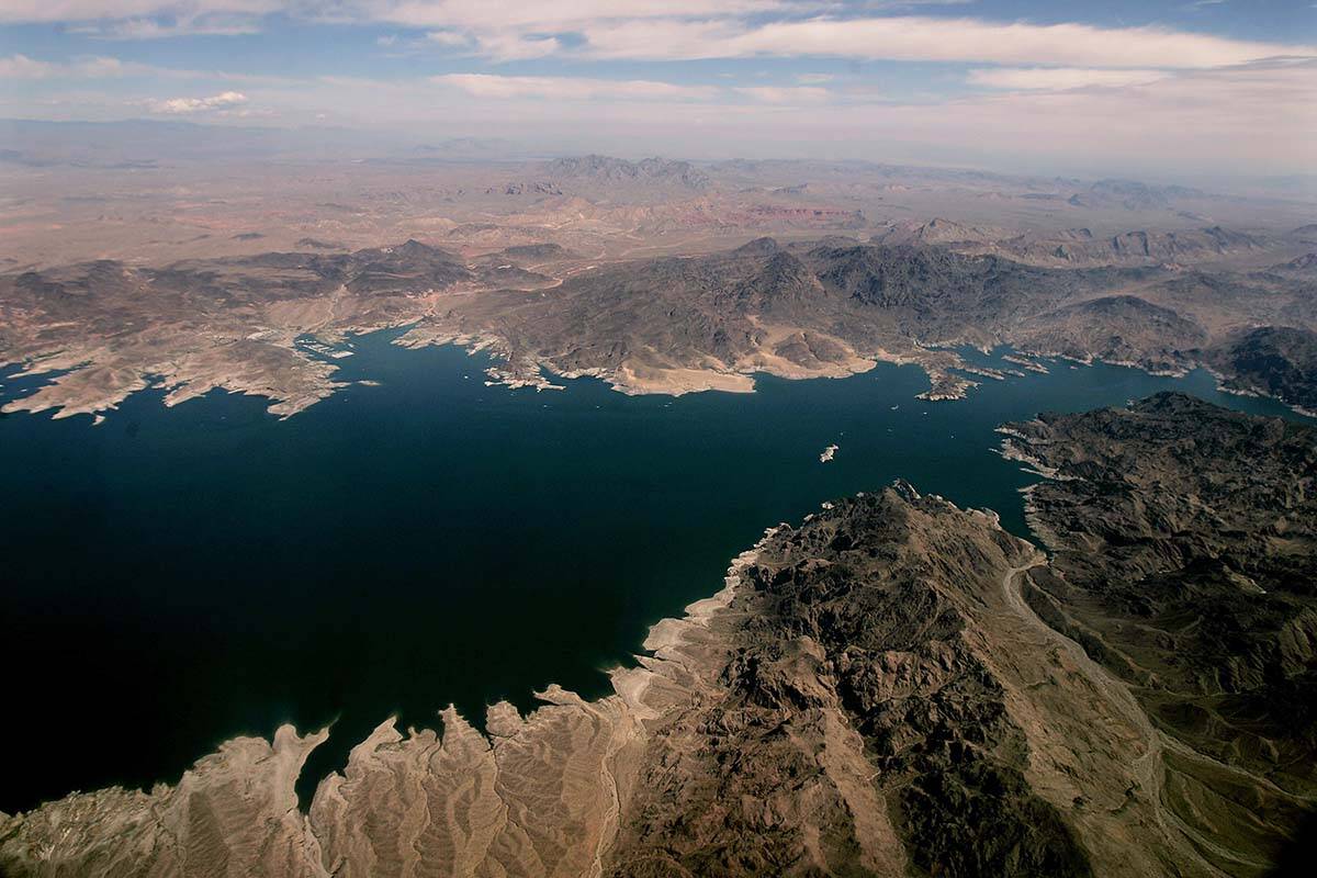 FILE - In this May 1, 2005, photo file, Lake Mead, which separates Arizona, bottom, and Nevada, ...