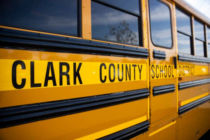 A Clark County School District bus is seen outside of Spring Valley High School in Las Vegas, W ...