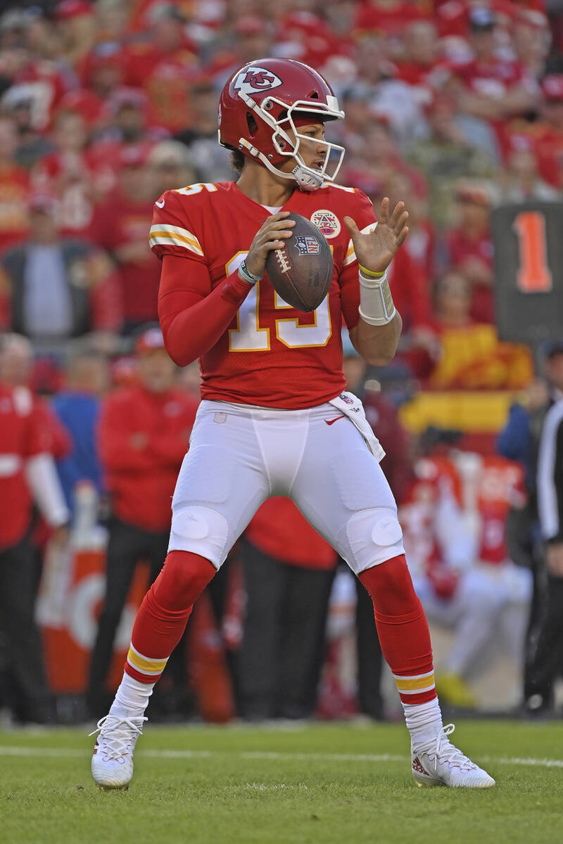 Kansas City Chiefs quarterback Patrick Mahomes (15) drops back during an NFL football game agai ...