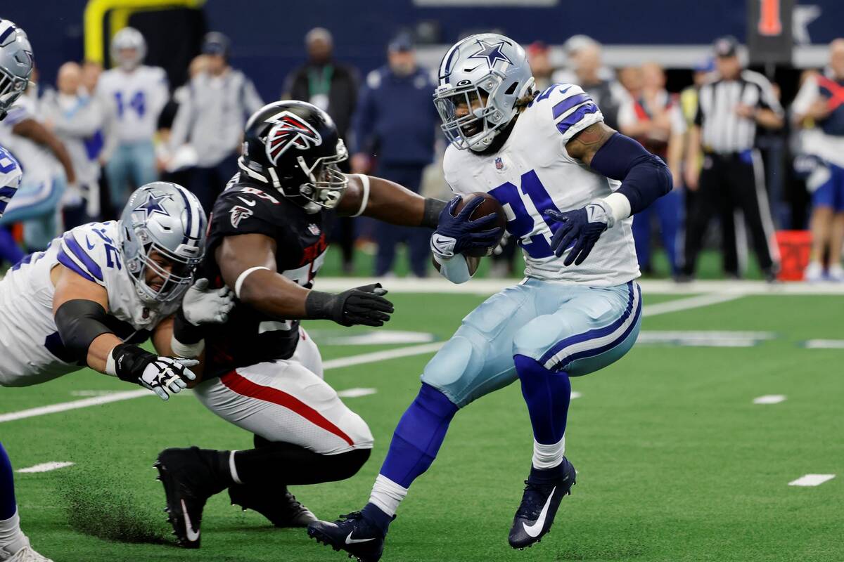 Dallas Cowboys guard Connor Williams, left, helps defend against Atlanta Falcons defensive tack ...