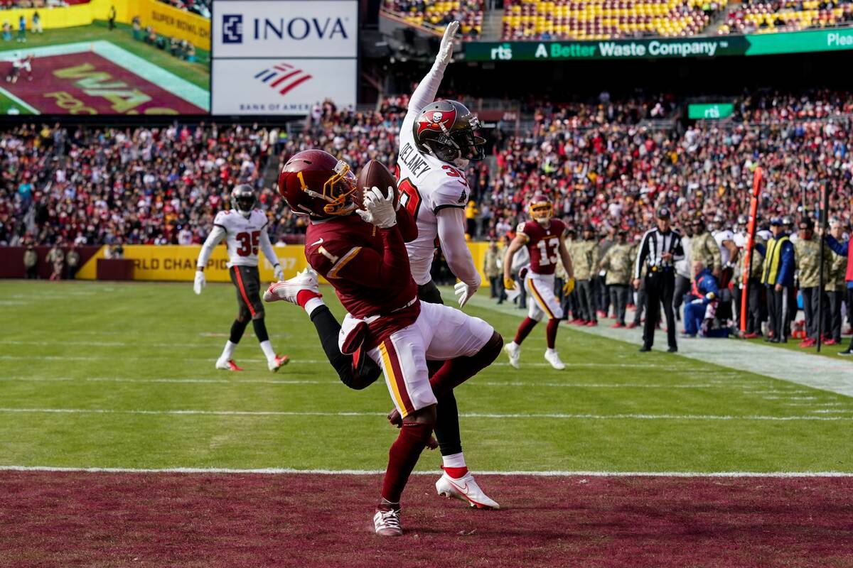 Washington Football Team wide receiver DeAndre Carter (1) catches a touchdown pass in front of ...