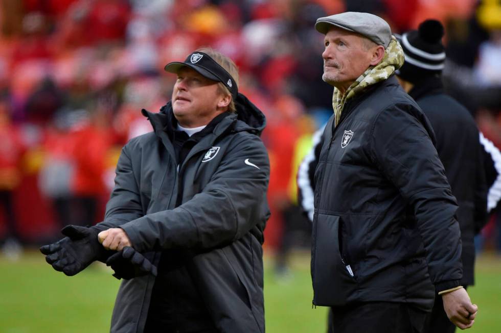 In this Dec. 1, 2019, file photo, Oakland Raiders general manager Mike Mayock stands with coach ...