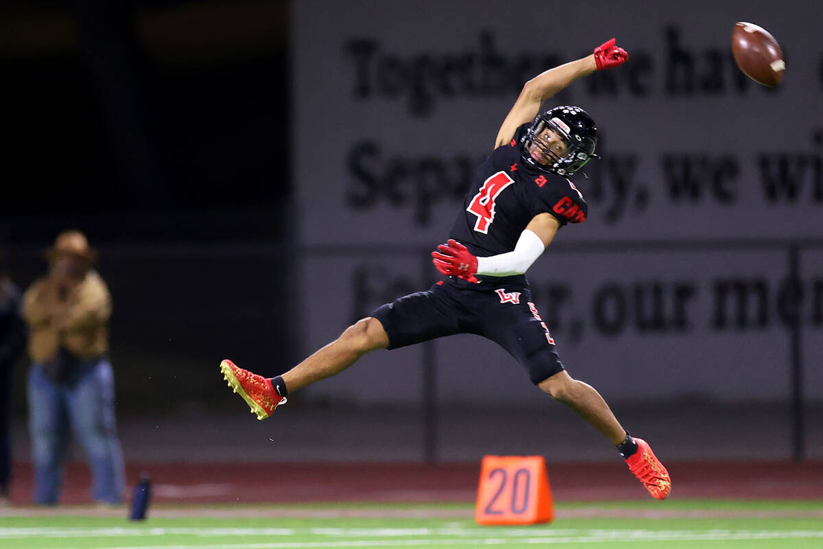 Las Vegas' Alvaro Zentino (4) misses an overthrown pass in the first half of the 4A state semif ...
