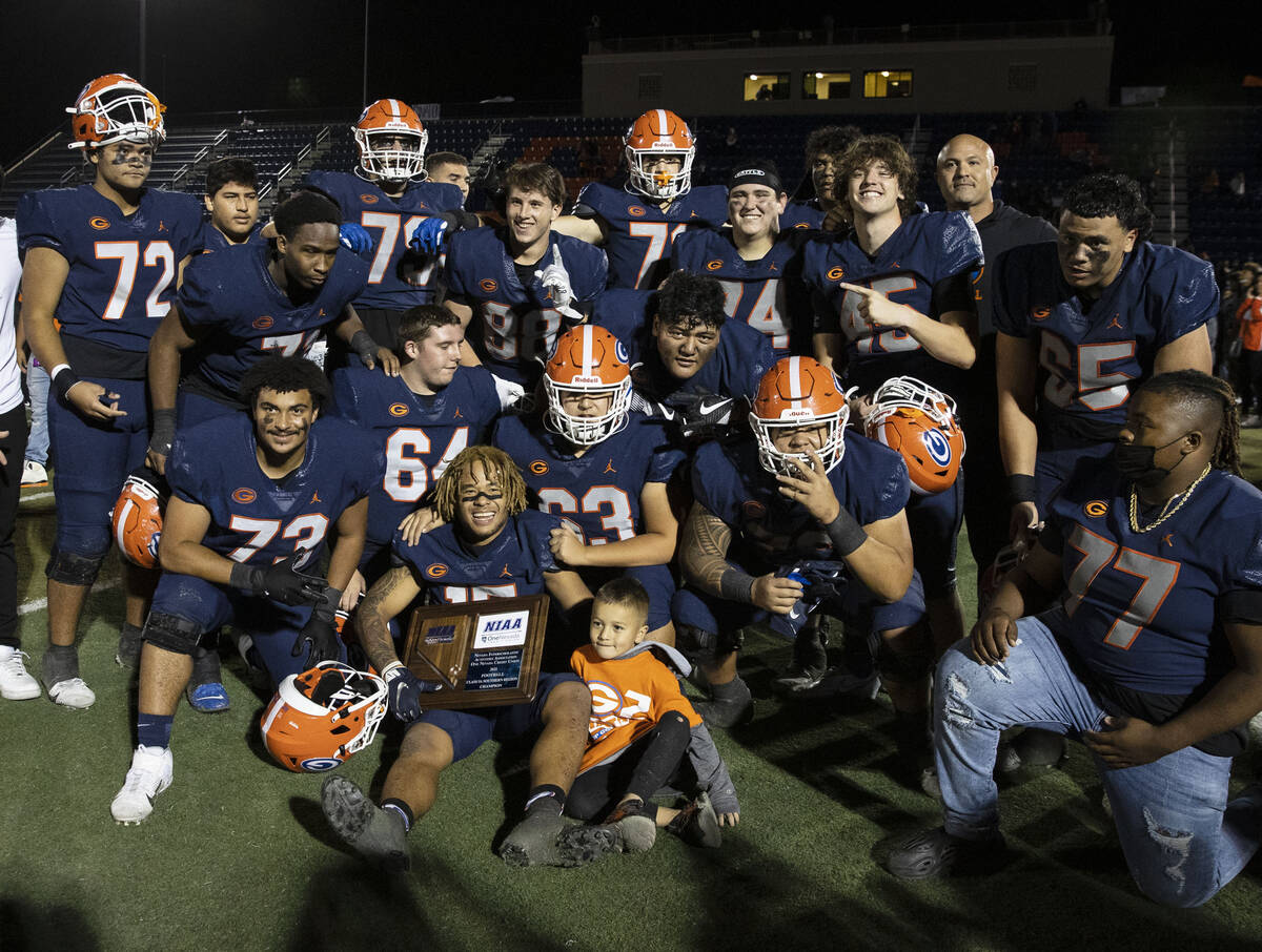 Bishop Gorman players celebrate after beating Liberty High during a Class 5A state semifinal fo ...