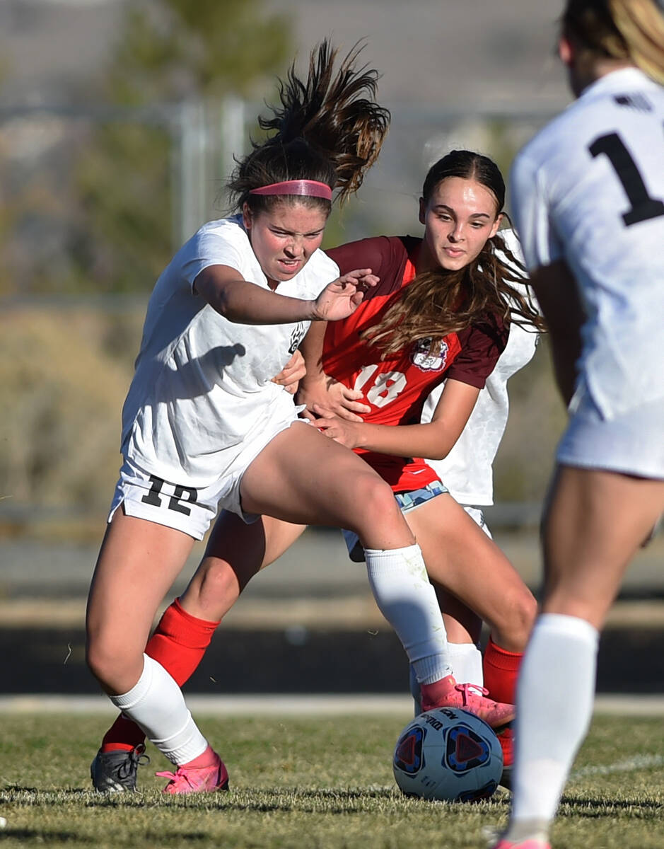 Coronado's Trinity Buchanan and Galena's Eryn Cryer battle it out during Friday's state playoff ...