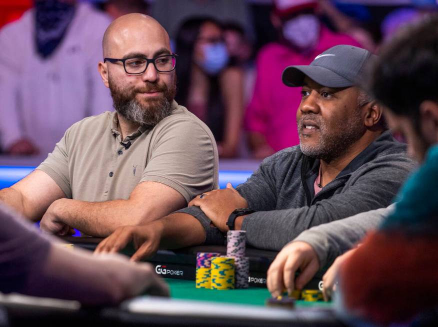 Ozgur Secilmis looks to George Holmes at the final table for the $10,000 buy-in Main Event at t ...