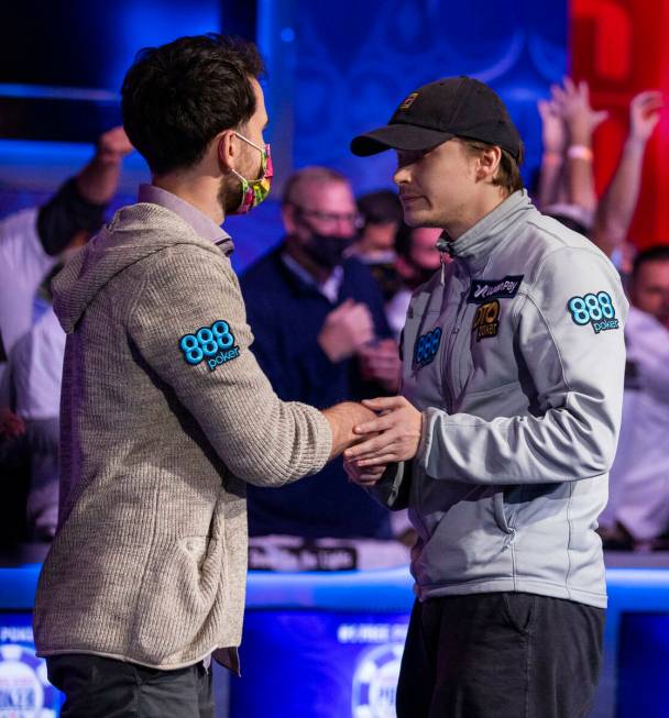 Koray Aldemir shakes hands with Jack Oliver eliminated and taking third place at the final tabl ...