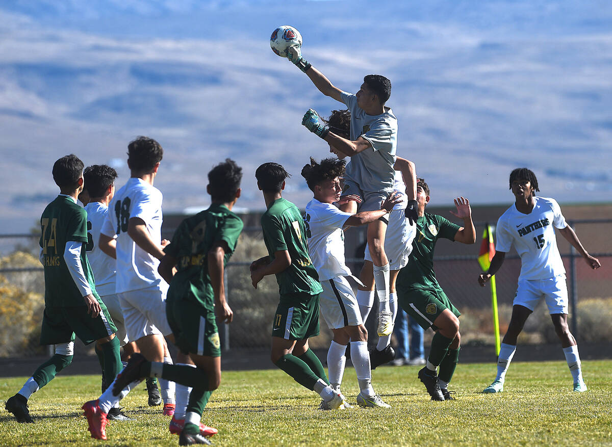 Hug's Issael Moctezuma makes a save while taking on Palo Verde during the NIAA boy's soccer cha ...