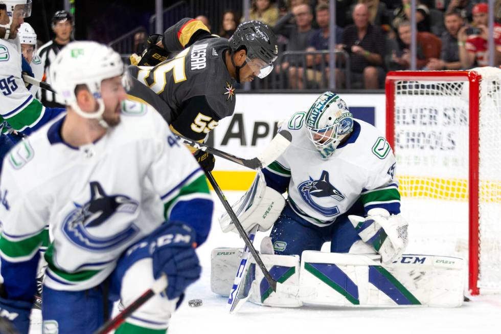 Golden Knights right wing Keegan Kolesar (55) attempts a goal as Canucks goaltender Thatcher De ...